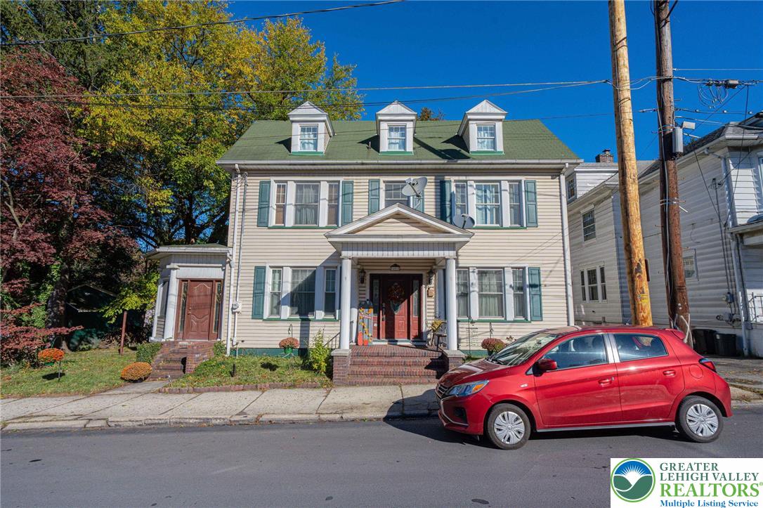 451 East Broad Street Tamaqua, PA 18252 - Photo 5 of 66 a front view of a house with a garden