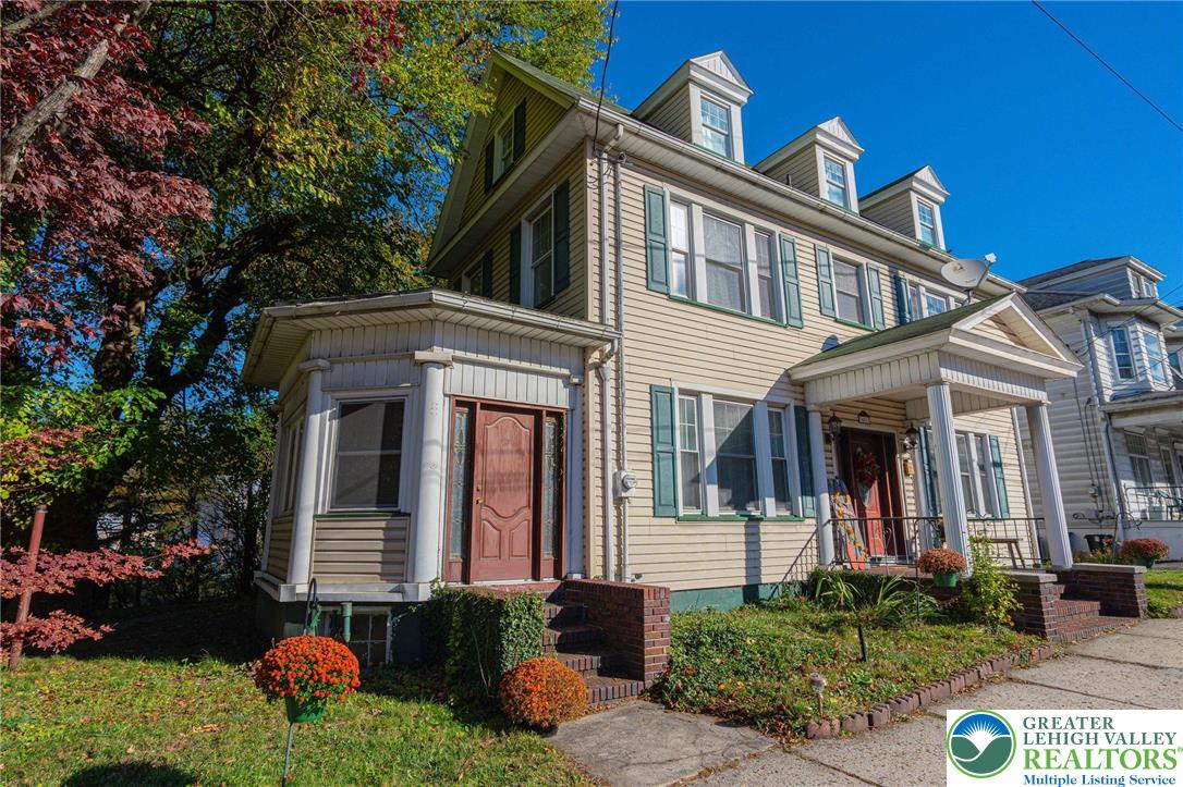 451 East Broad Street Tamaqua, PA 18252 - Photo 6 of 66 a front view of a house with garden
