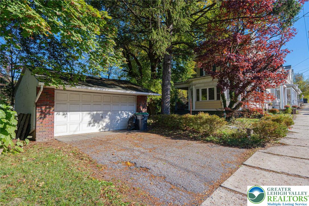 451 East Broad Street Tamaqua, PA 18252 - Photo 7 of 66 a front view of a house with a yard and garage
