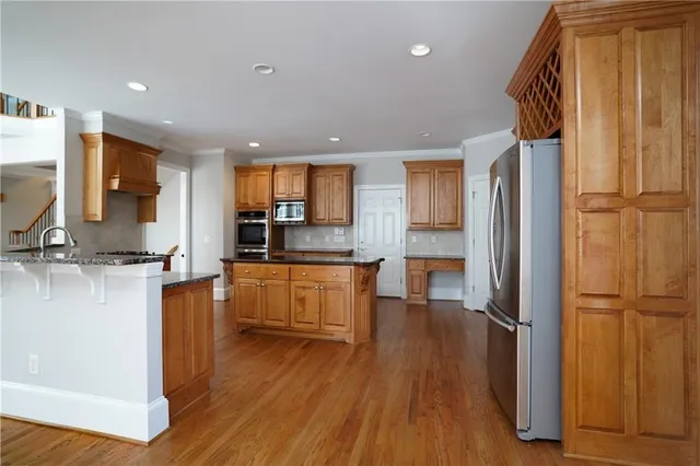 a view of an empty room with a fireplace and a window