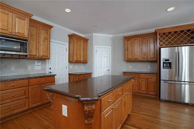 a spacious bathroom with a granite countertop double vanity sink and a mirror
