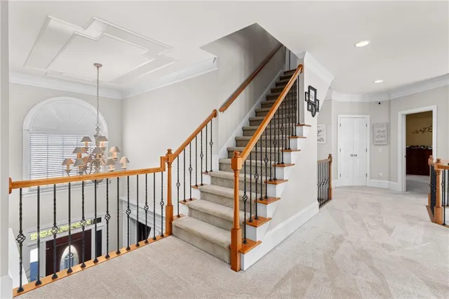 a spacious bathroom with a granite countertop sink a mirror and shower