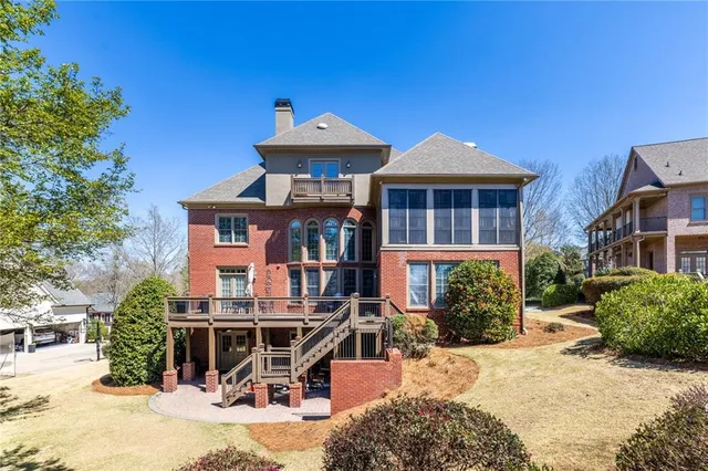an empty room with chandelier fan