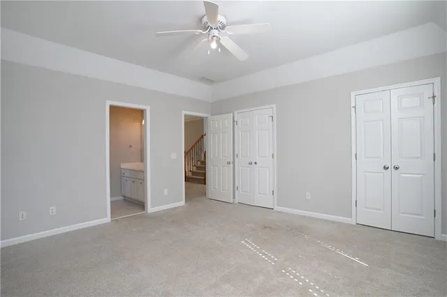 a balcony with furniture and a potted plant