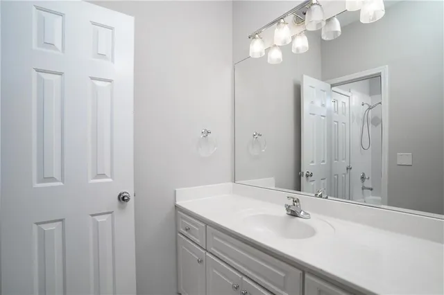 a view of a yard with swimming pool and trees in the background