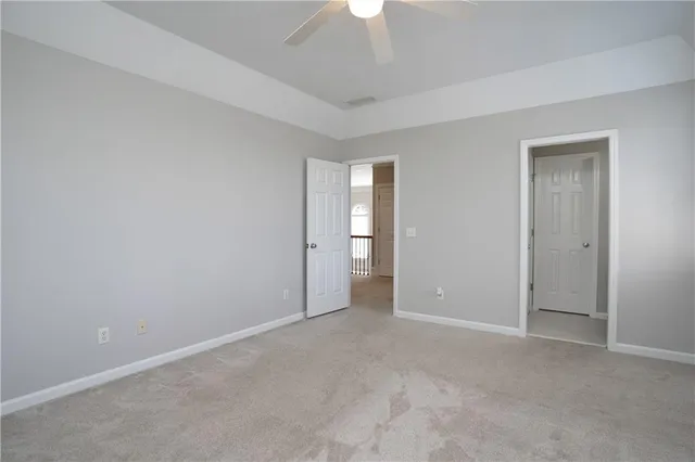 an aerial view of house with yard and mountain view in back