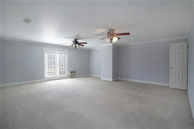 an aerial view of a house with a yard and trees