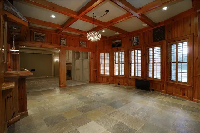 an aerial view of residential houses with outdoor space and river