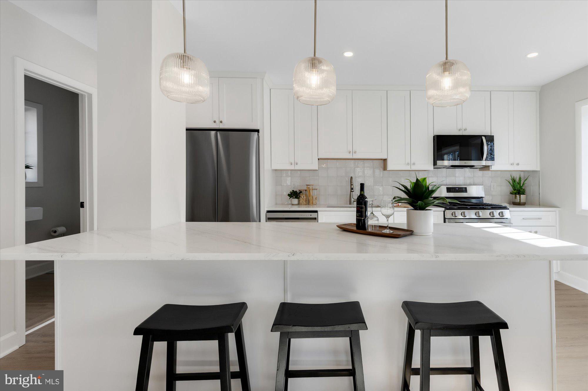 3254 Gunston Road Alexandria, VA 22302 - Photo 10 of 37 Island with seating and pendant lighting