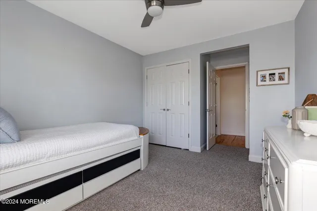 a bed room with a bed and a tv