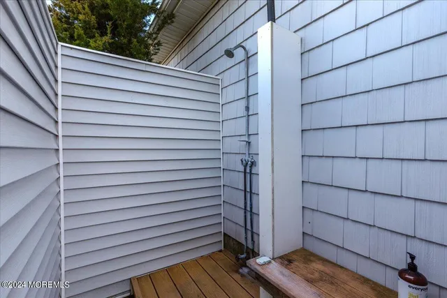 a view of a house with a wooden deck