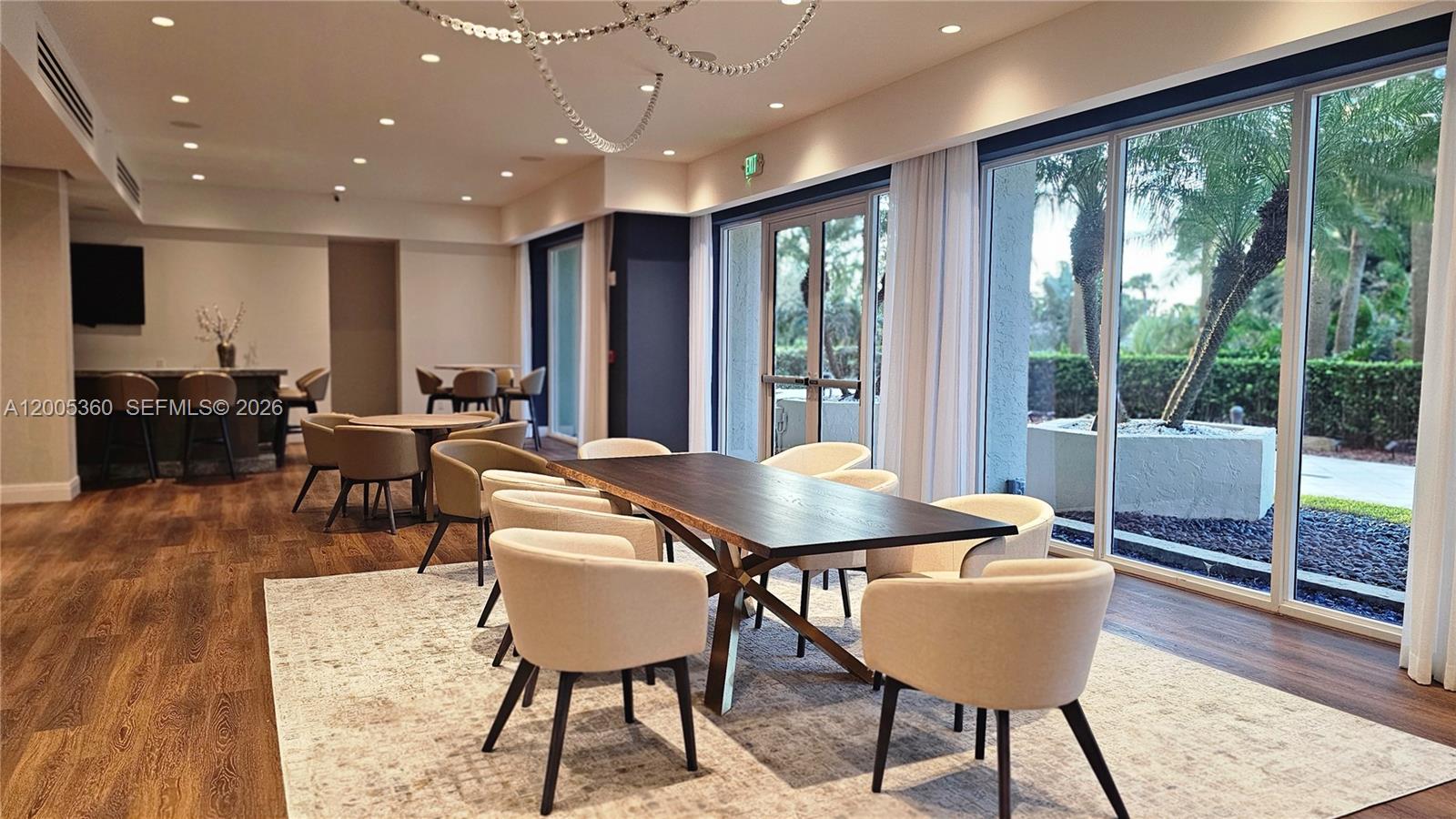 4001 North Ocean Boulevard, Unit 702 Boca Raton, FL 33431 - Photo 48 of 56 a view of a dining room with furniture window and wooden floor