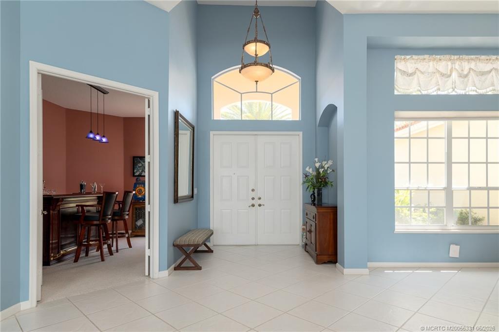 2216 Southeast Stonehaven Road Port St. Lucie, FL 34952 - Photo 25 of 67 a view of a livingroom with furniture and a window