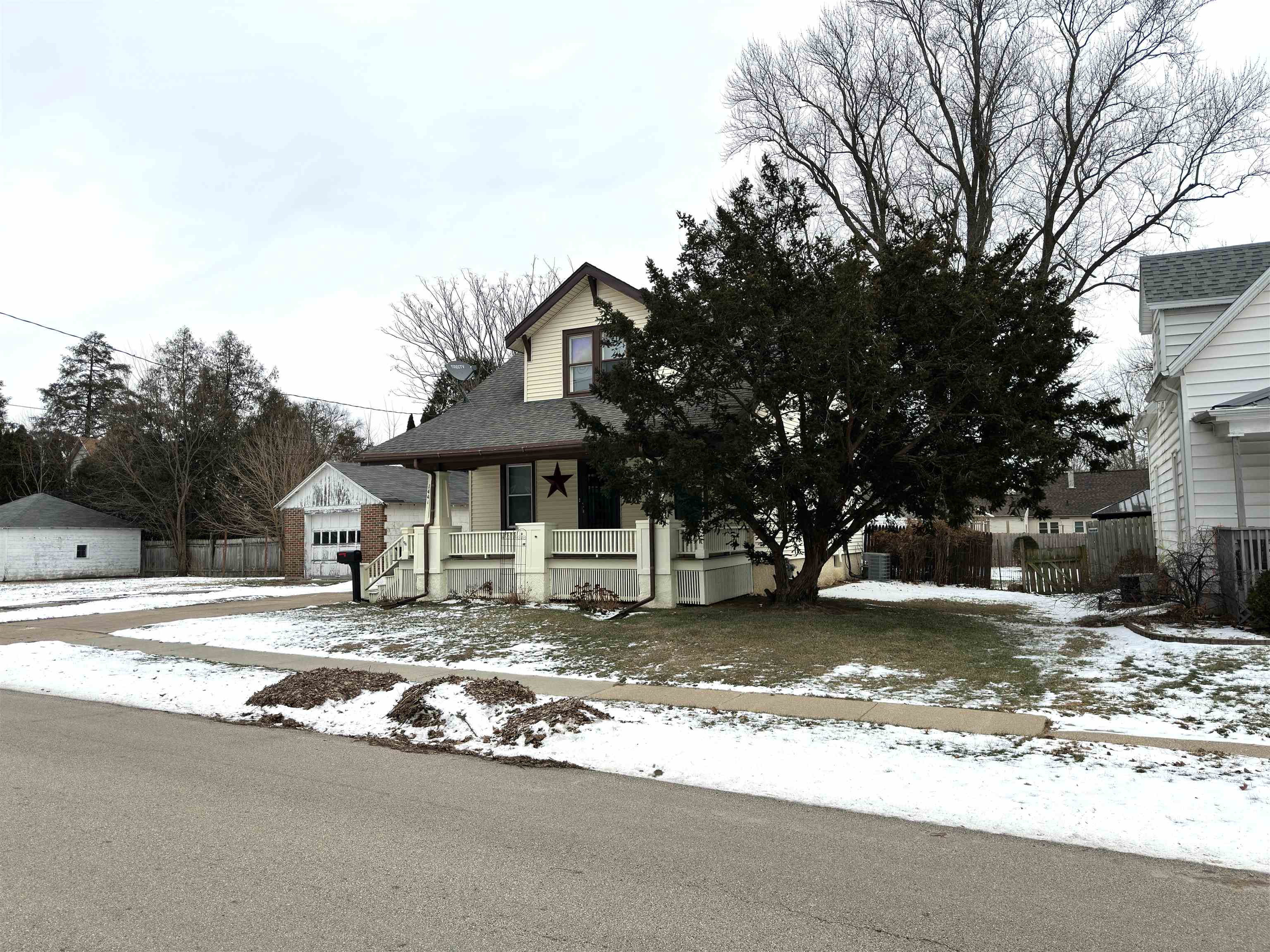1441 South Float Avenue Freeport, IL 61032 - Photo 19 of 31 a view of a house with a yard covered in snow