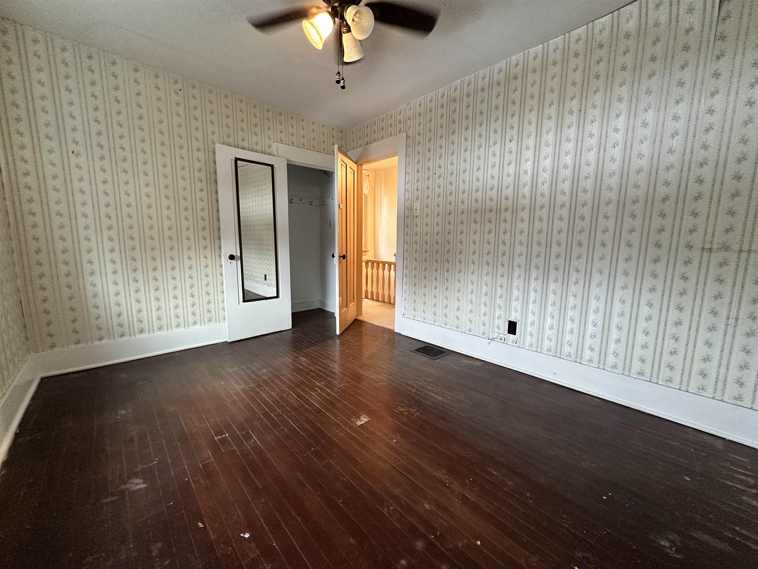 1441 South Float Avenue Freeport, IL 61032 - Photo 6 of 31 wooden floor in an empty room with a window