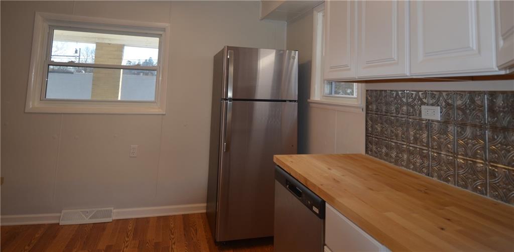 340 Prestley Road Bridgeville, PA 15017 - Photo 14 of 23 a kitchen with a refrigerator and window