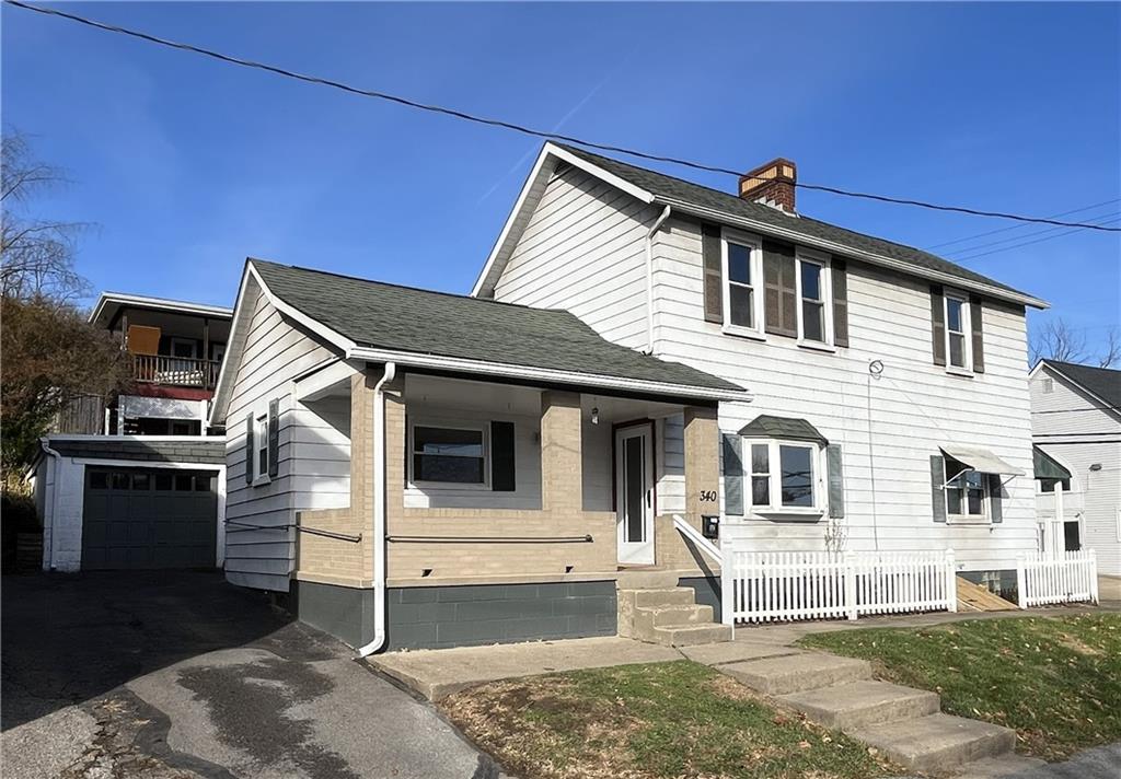 340 Prestley Road Bridgeville, PA 15017 - Photo 2 of 23 a front view of a house with a garage