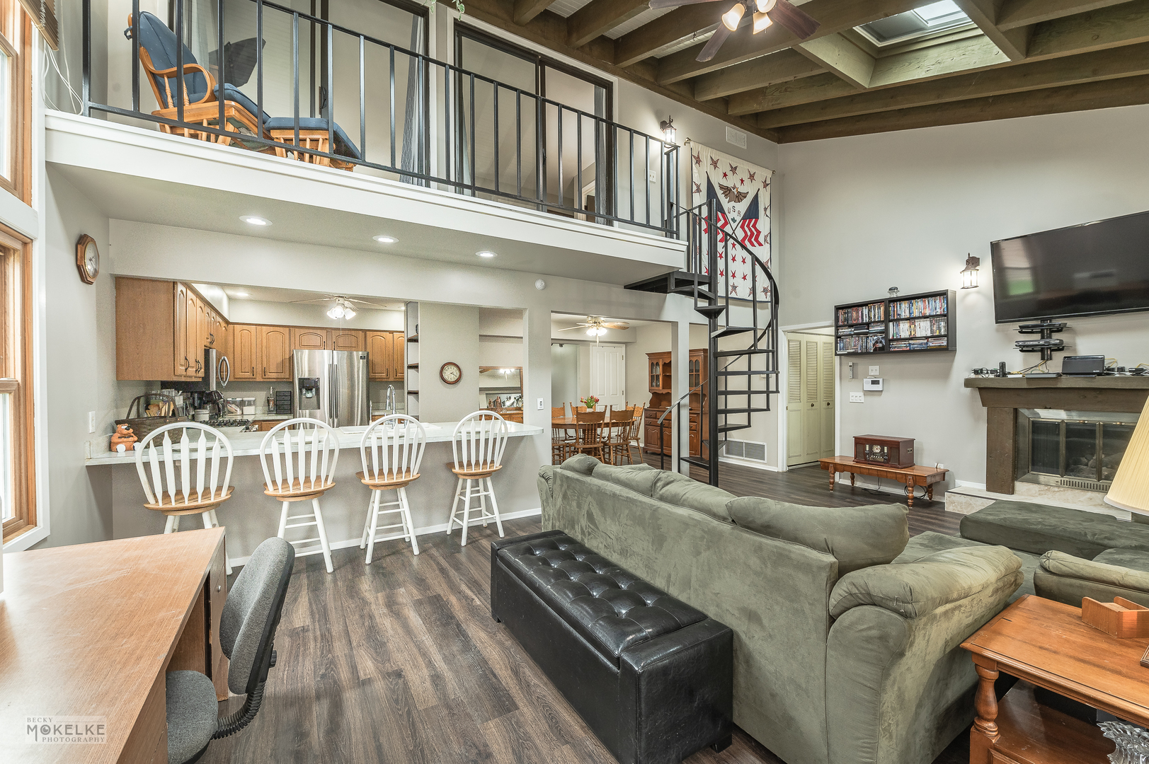 14 Pembrooke Road Montgomery, IL 60538 - Photo 6 of 28 a living room with furniture a flat screen tv and kitchen view
