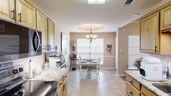a kitchen with granite countertop lots of counter top space