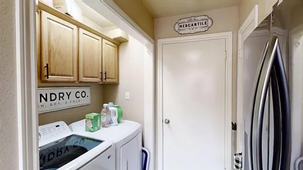 a utility room with washer and dryer