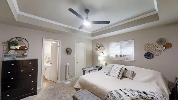 a bedroom with a bed and a dresser