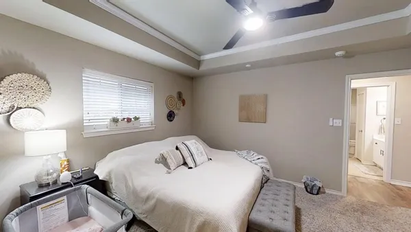 a bedroom with a bed and window