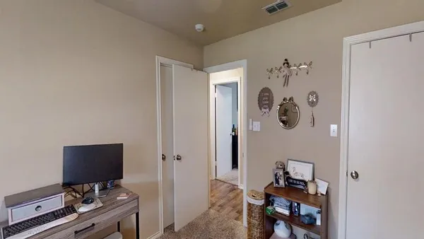a view of a patio with table and chairs and potted plants
