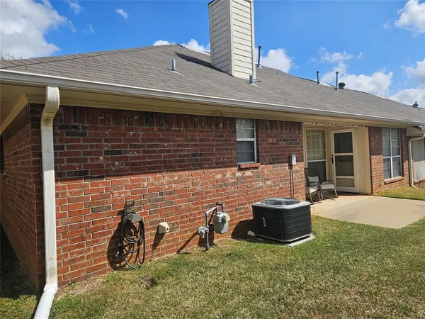 a backyard of a house with seating space