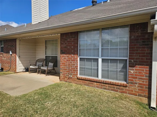 a couple of chairs in front of door