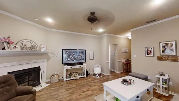 a living room with furniture and a fireplace