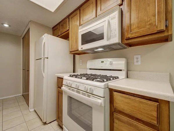 a kitchen with a stove and a microwave