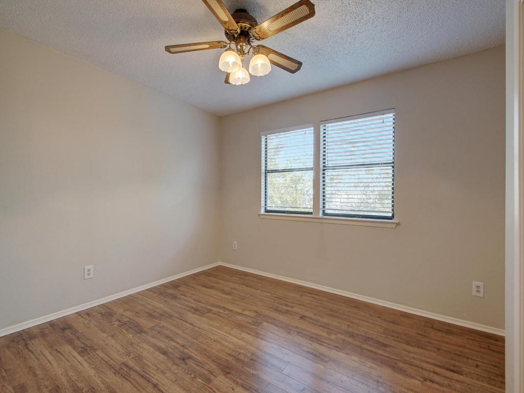 11301 Jollyville Road, Unit A3 Austin, TX 78759 - Photo 21 of 26 wooden floor in an empty room with a window