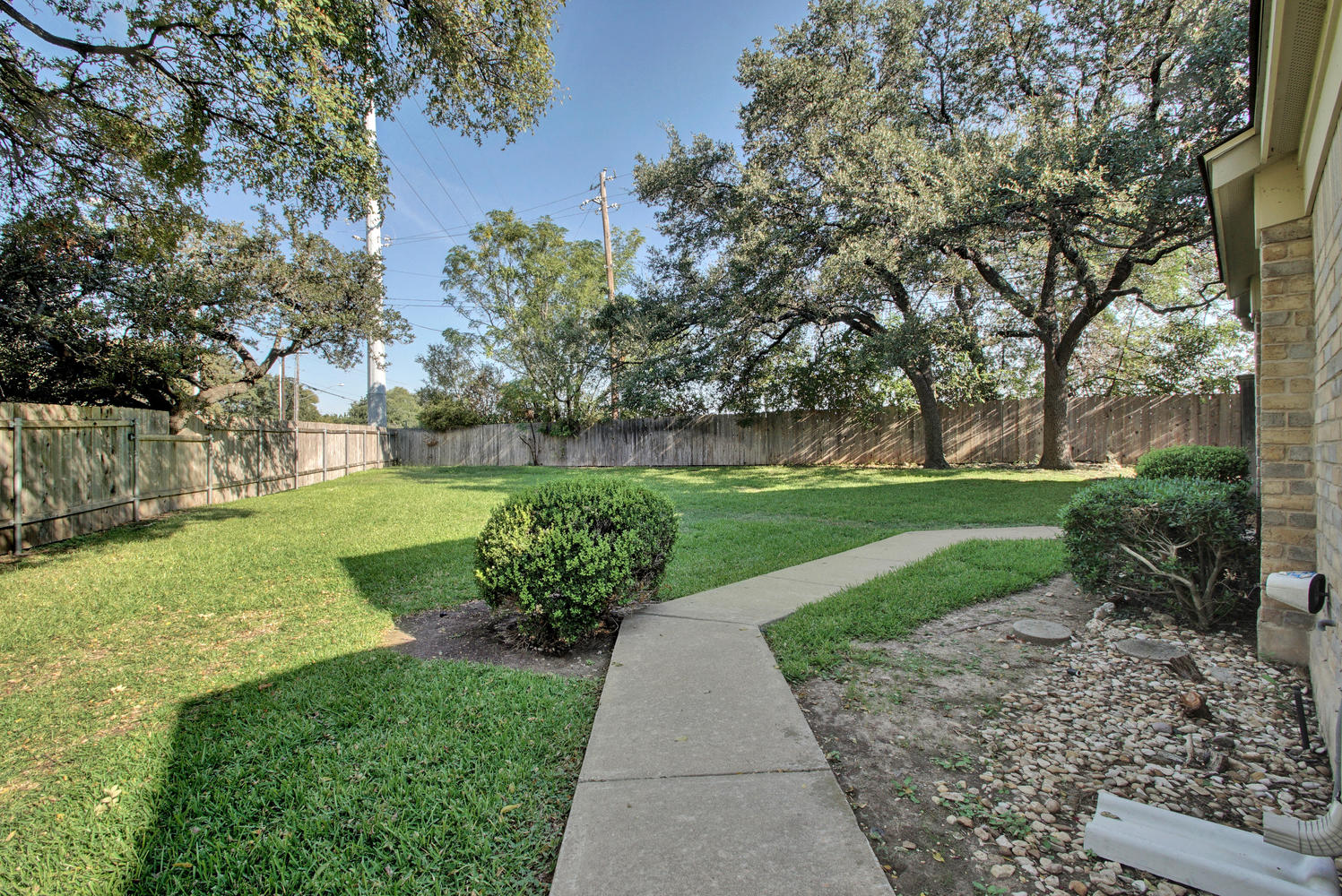11301 Jollyville Road, Unit A3 Austin, TX 78759 - Photo 25 of 26 a view of a garden with plants and large trees