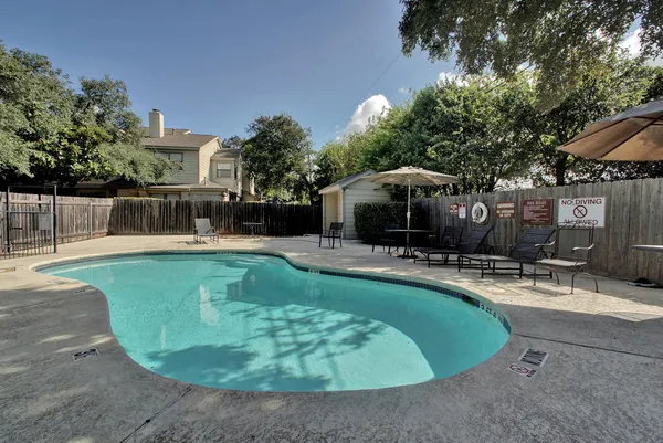 a view of a swimming pool with a patio