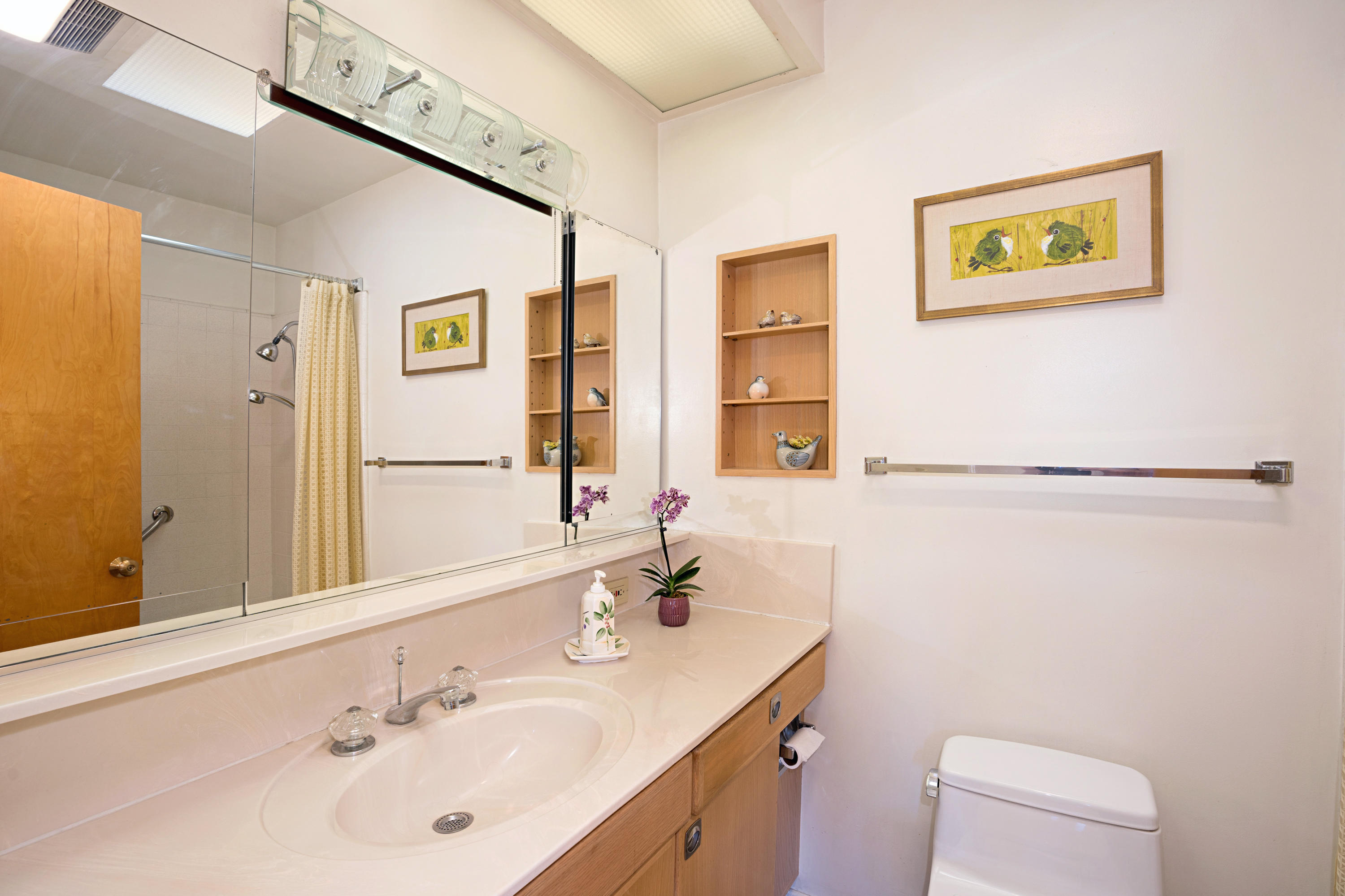 817 Arguello Road Santa Barbara, CA 93103 - Photo 28 of 42 a bathroom with a sink a toilet and shower curtain