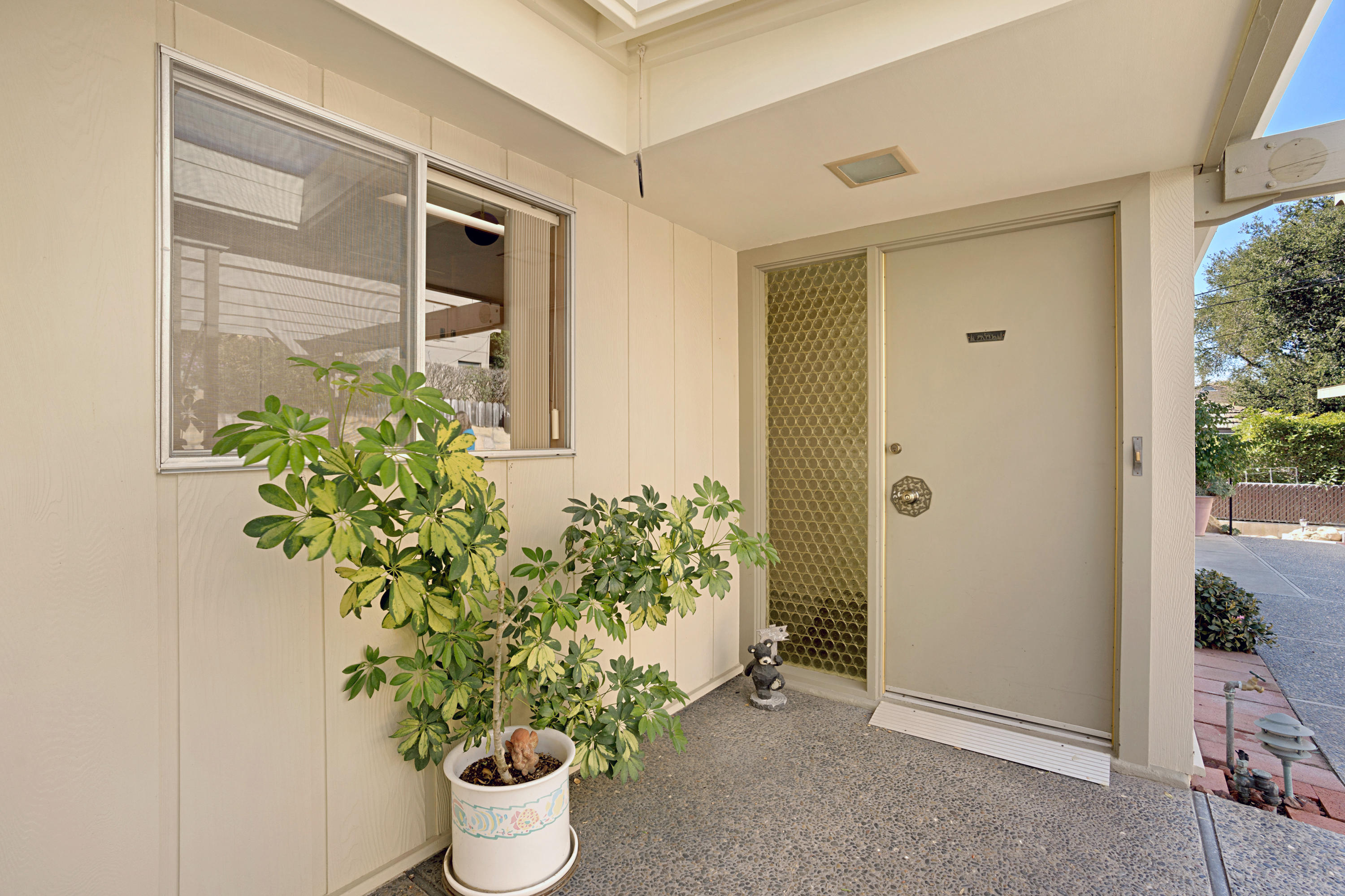 817 Arguello Road Santa Barbara, CA 93103 - Photo 3 of 42 a front view of a house with a potted plant and a window