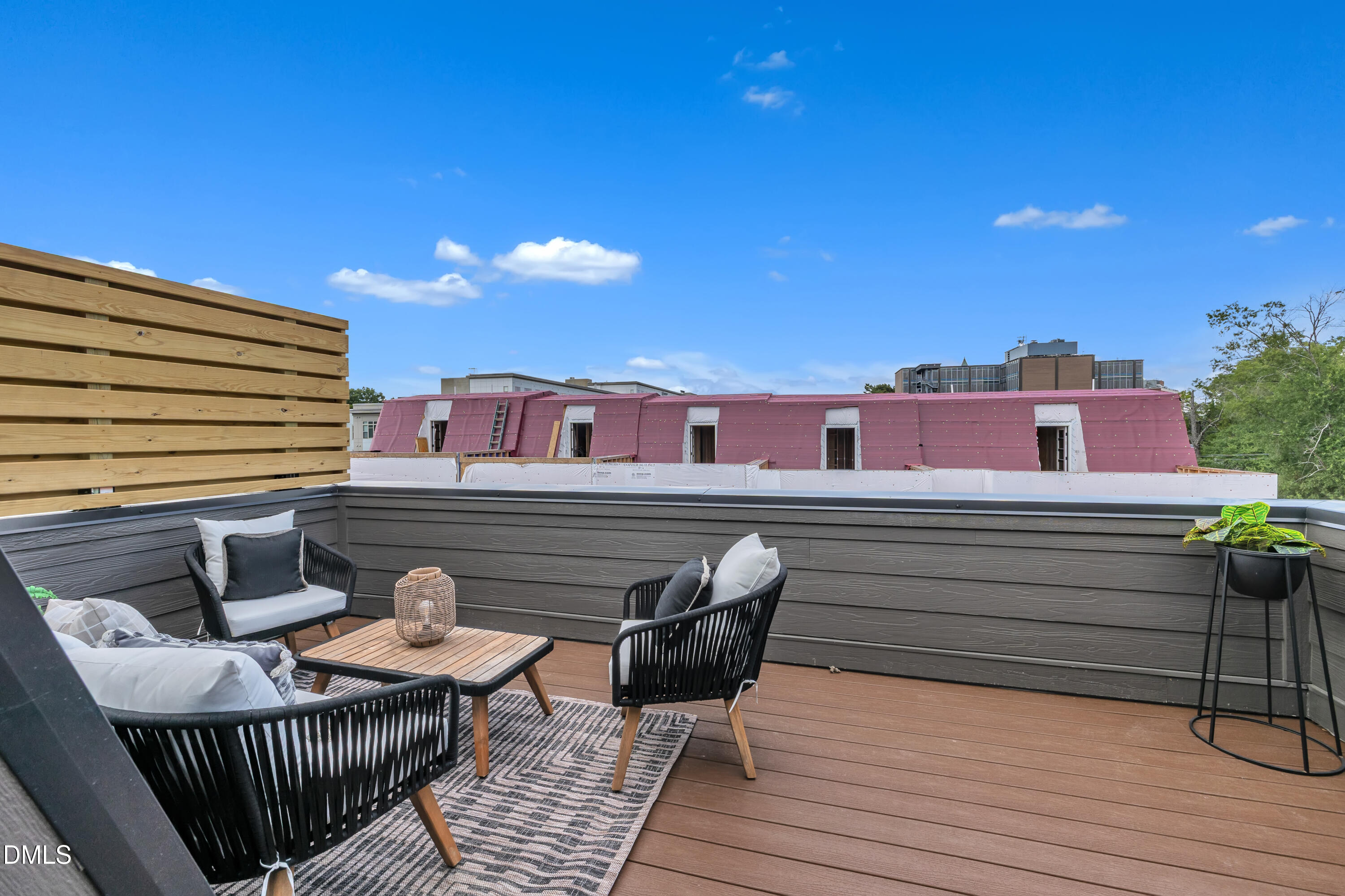 512 Gordon Street, Unit 1101 Durham, NC 27701 - Photo 30 of 32 a view of a roof deck with dining table and chairs with wooden floor
