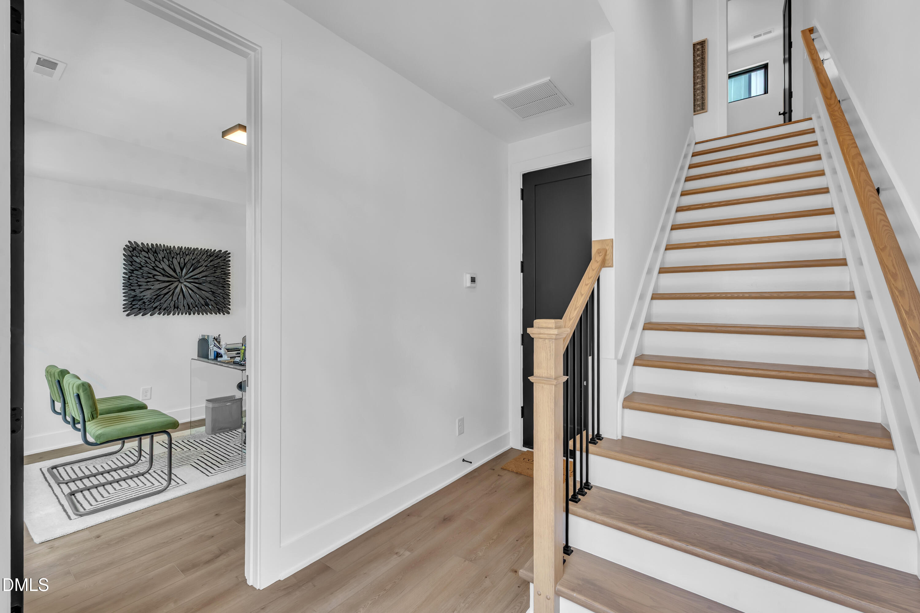 512 Gordon Street, Unit 1101 Durham, NC 27701 - Photo 7 of 32 a view of entryway with stairs and wooden floor