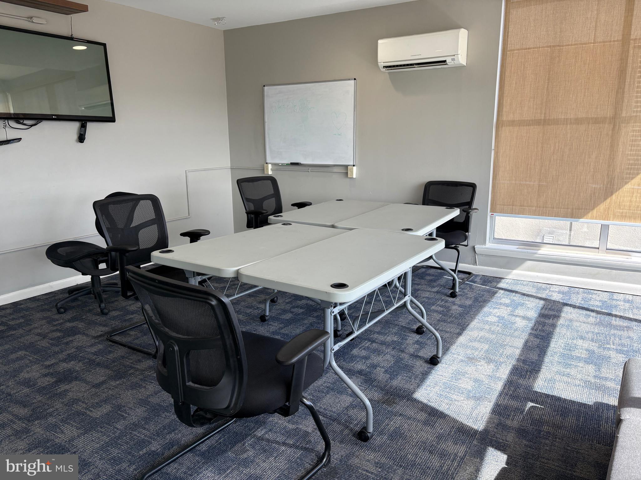 1000 Diamond Street, Unit C Philadelphia, PA 19122 - Photo 22 of 26 a living room with furniture and a flat screen tv