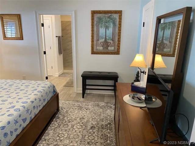 a bedroom with a bed and a table