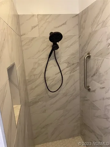 a white toilet sitting next to a bathroom sink