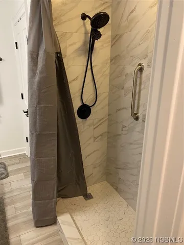 a bathroom with a granite countertop sink toilet and mirror
