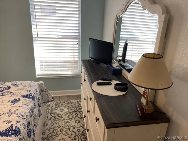 a living room with furniture and a closet