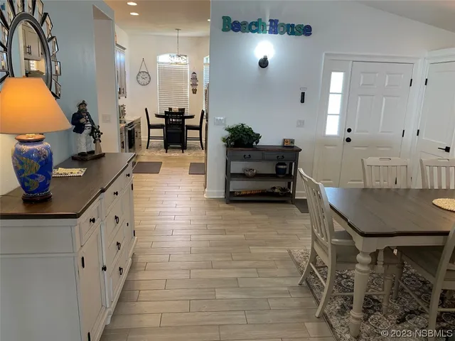 a lobby with furniture and chandelier