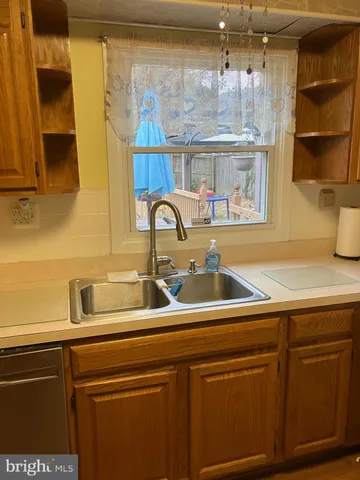 a kitchen with a sink and a window