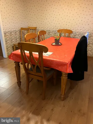 a balcony with table and chairs