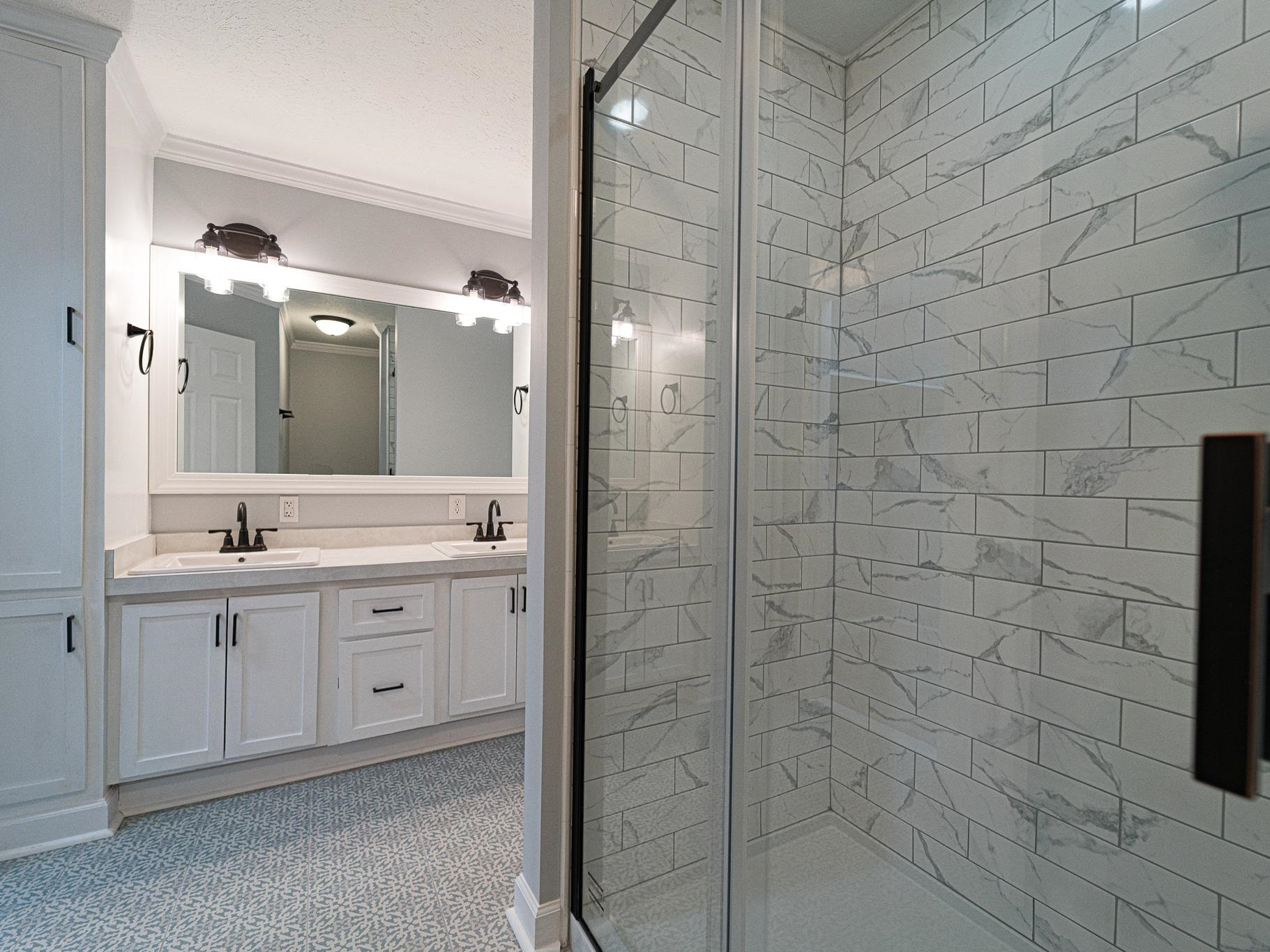 9961 Old Middlesex Road Middlesex, NC 27557 - Photo 19 of 30 a bathroom with a shower and a sink