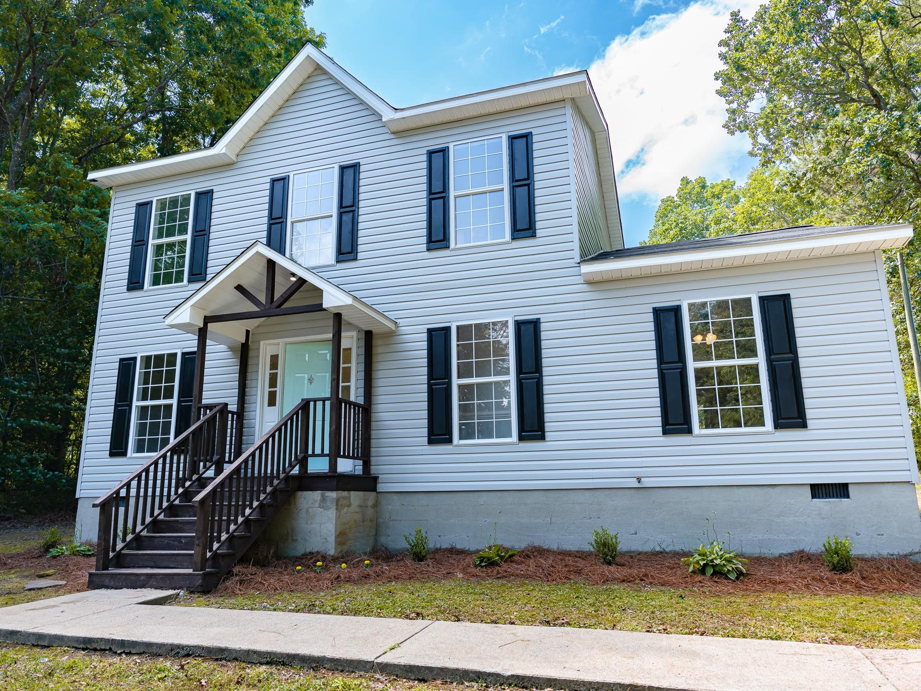 9961 Old Middlesex Road Middlesex, NC 27557 - Photo 2 of 30 a front view of a house with a yard