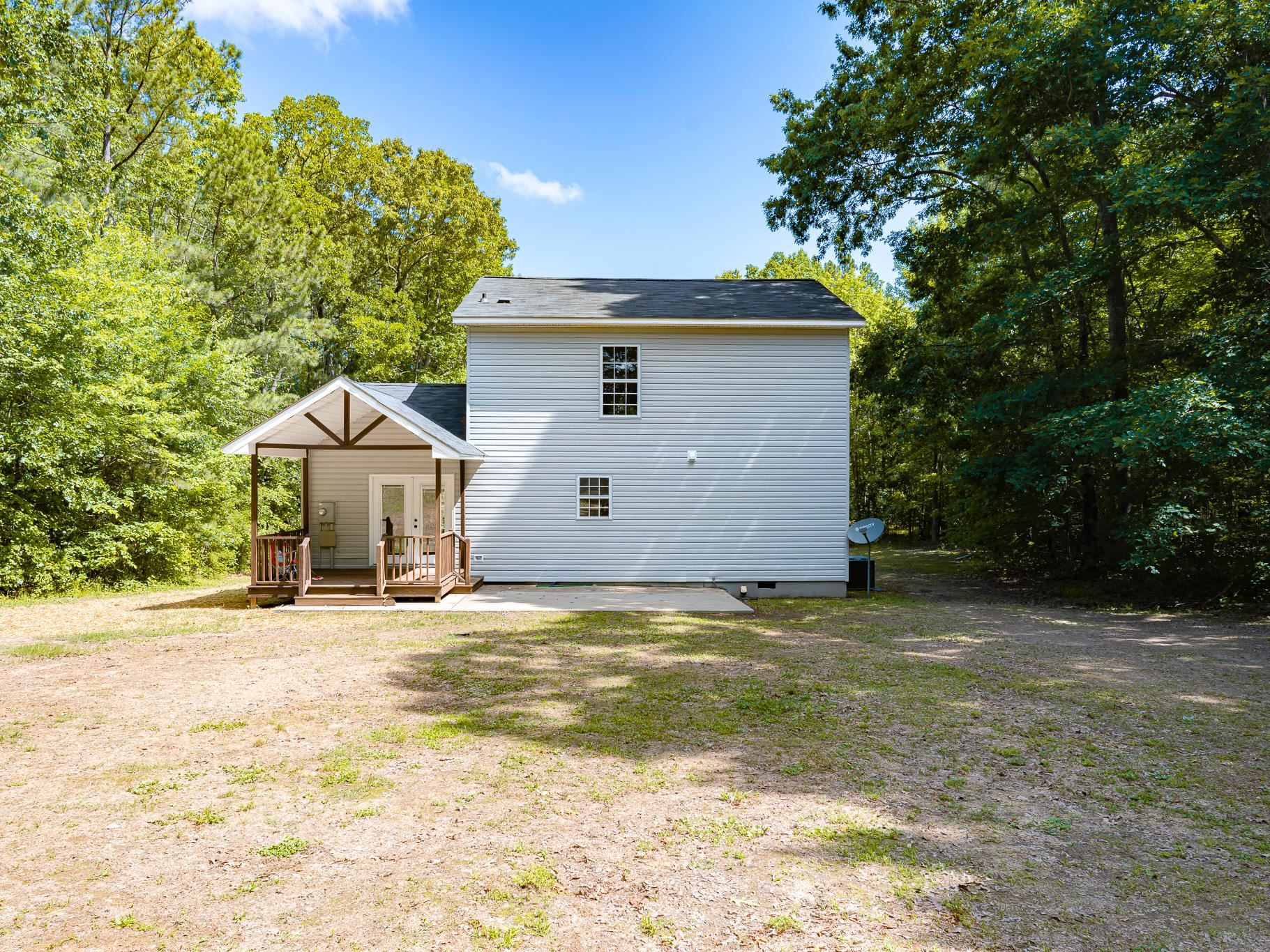 9961 Old Middlesex Road Middlesex, NC 27557 - Photo 30 of 30 a view of a house with a yard