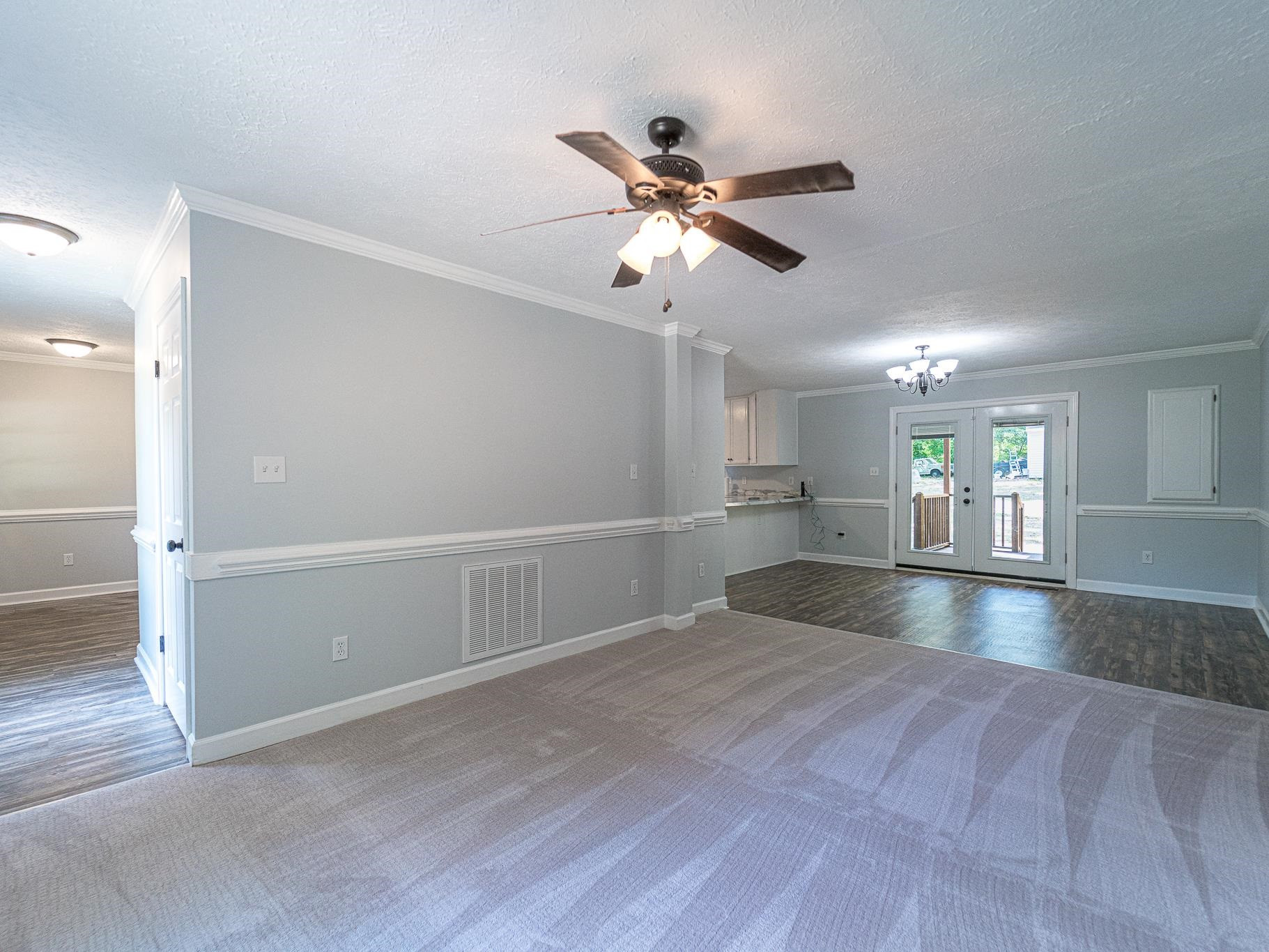 9961 Old Middlesex Road Middlesex, NC 27557 - Photo 6 of 30 a view of empty room with wooden floor and fan